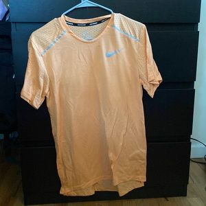 Coral colored Nike running top